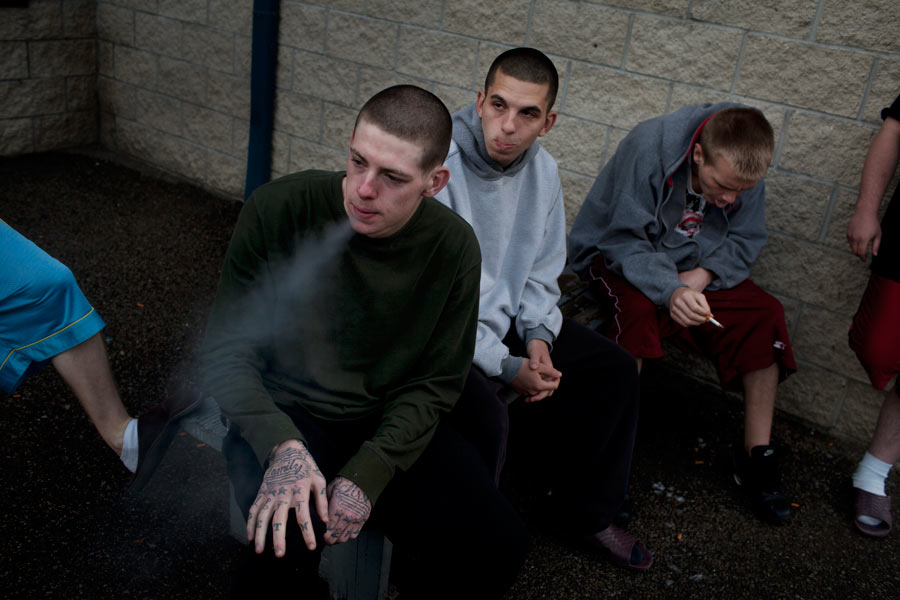 Nikki Geer, Michael Johnston, and Justin Moore smoke on the yard at the SEPTA. Geer, 20, was released from SEPTA in mid April, after serving three years for burglary in Noble Correctional. He rejoined his fiancé and three-year-old son and has had trouble finding a job.