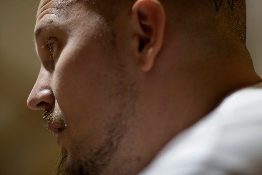 Douglas Dean Starcher Jr. plays cards in a common area with other residents. Starcher, 31, has spent 10 years and seven months of his adult life behind bars.